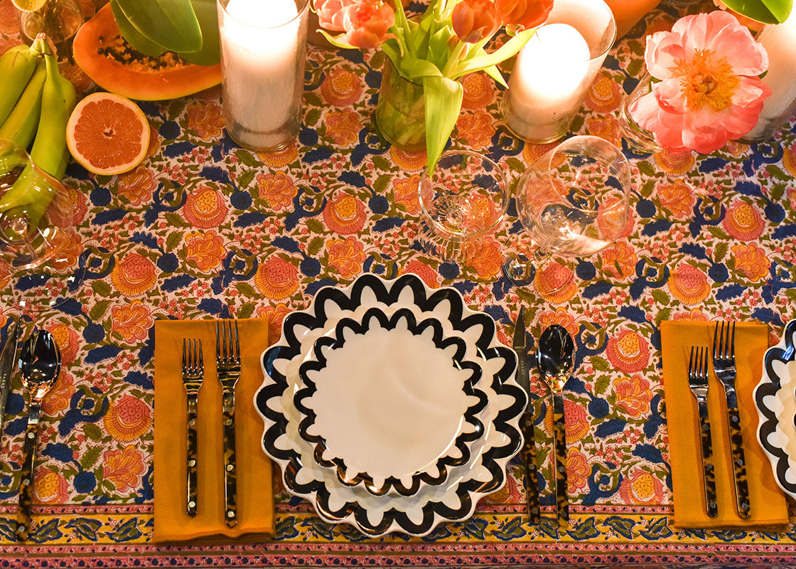 Overhead View of Black Arabesque Trim Scallop Salad Plate in Beautiful Candlelit Tablescape
