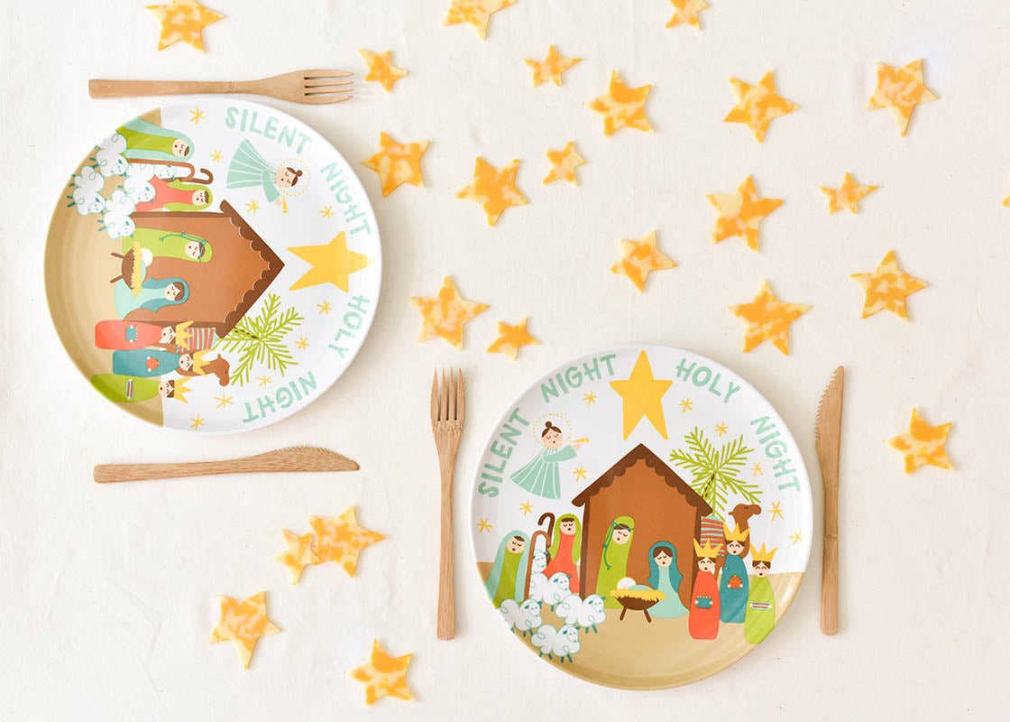 Overhead View of Two Place Settings Including Christmas Nativity Melamine Dinner Plate