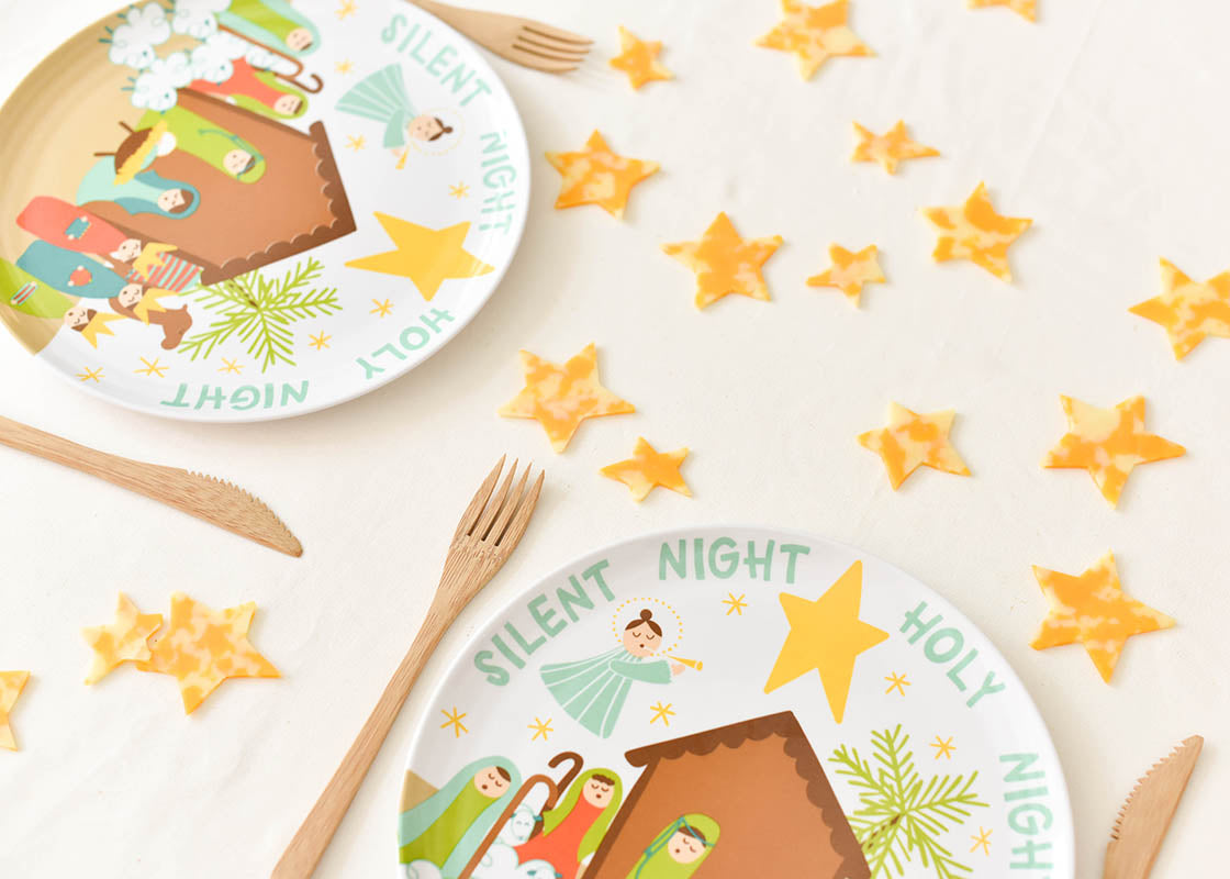 Cropped Close up of Two Place Settings Including Christmas Nativity Melamine Dinner Plate with Stars