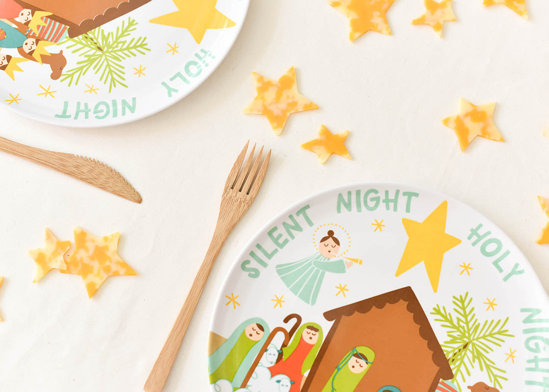 Cropped Close up of Two Place Settings Including Christmas Nativity Melamine Dinner Plate