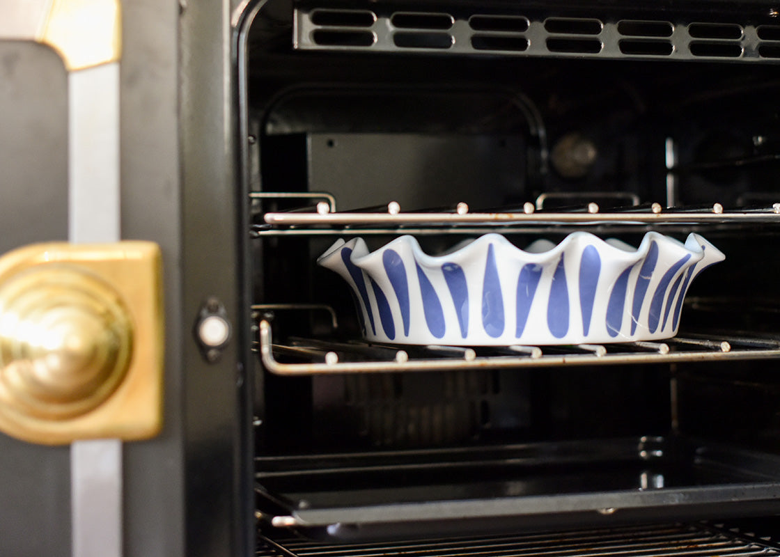 Cropped Close up of Ruffled Pie Dish in Oven on Oven Rack