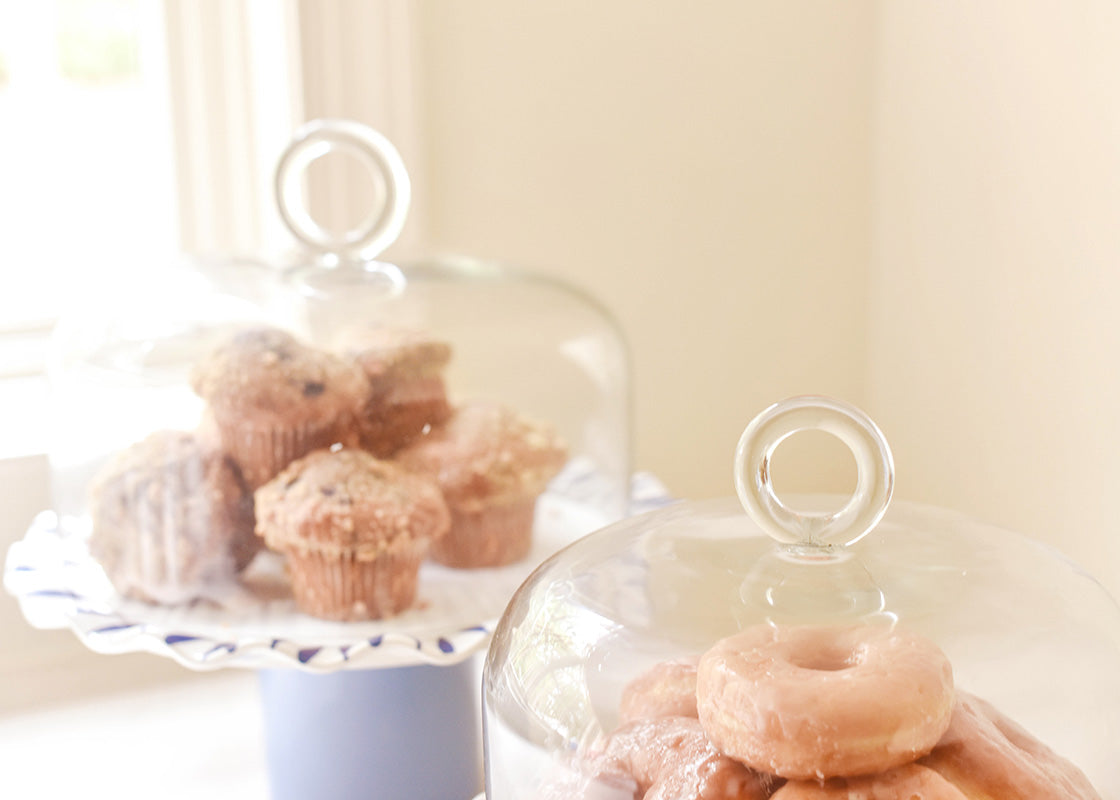 Cropped View of Ring Handles on Glass Domes Placed on Cake Stands