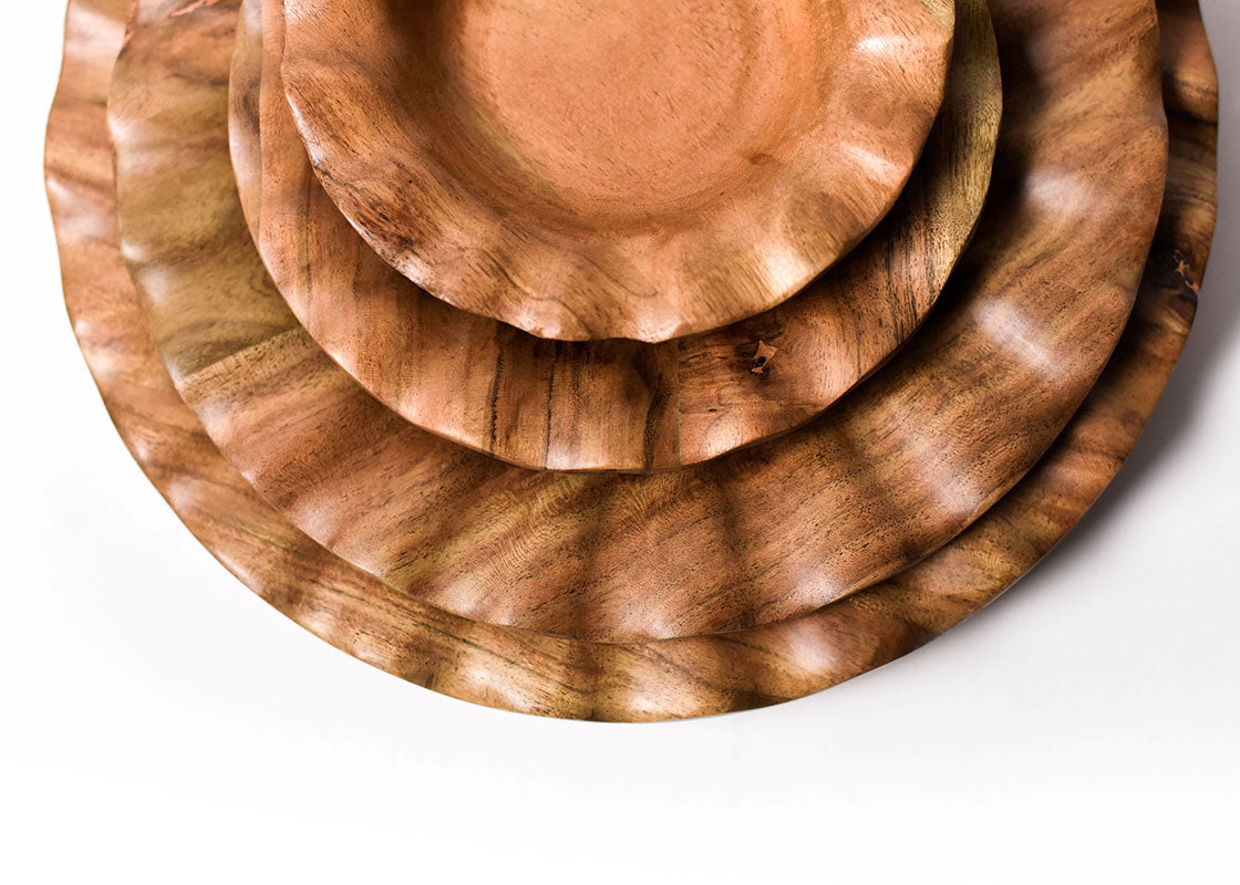 Cropped Close up of Ruffled Edges on Stacked Coordinating Place Setting Including Fundamental Wood Ruffle Small Bowl