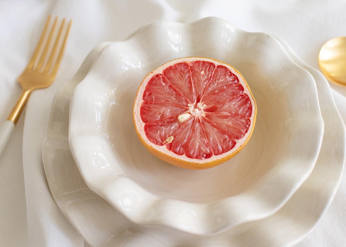 Extreme Cropped Close up of Place Setting with Signature White Ruffle Flare Small Bowl