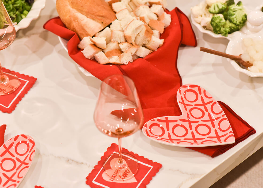 Cropped Close up of XOXO Heart Plate used as Individual Place Setting in Valentine's Themed Tablescape