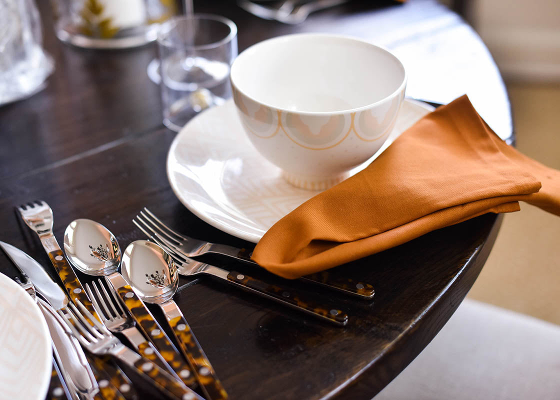 Cropped View of Setting the Table with Footed Bowl Blush Arabesque Design and Coordinating Tableware