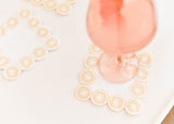 Cocktail Glassees Highlighted by Cocktail Napkins Blush Arabesque Design