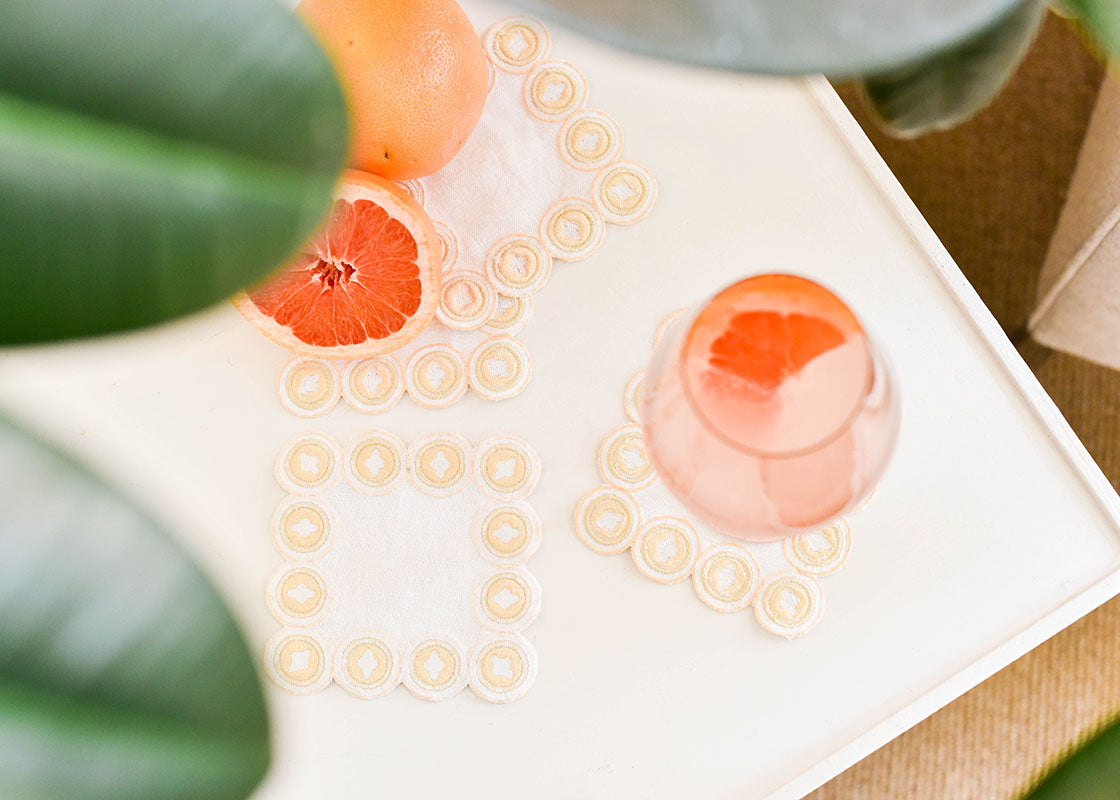 Overhead View of Cocktails on Linen Blush Arabesque Cocktail Napkins