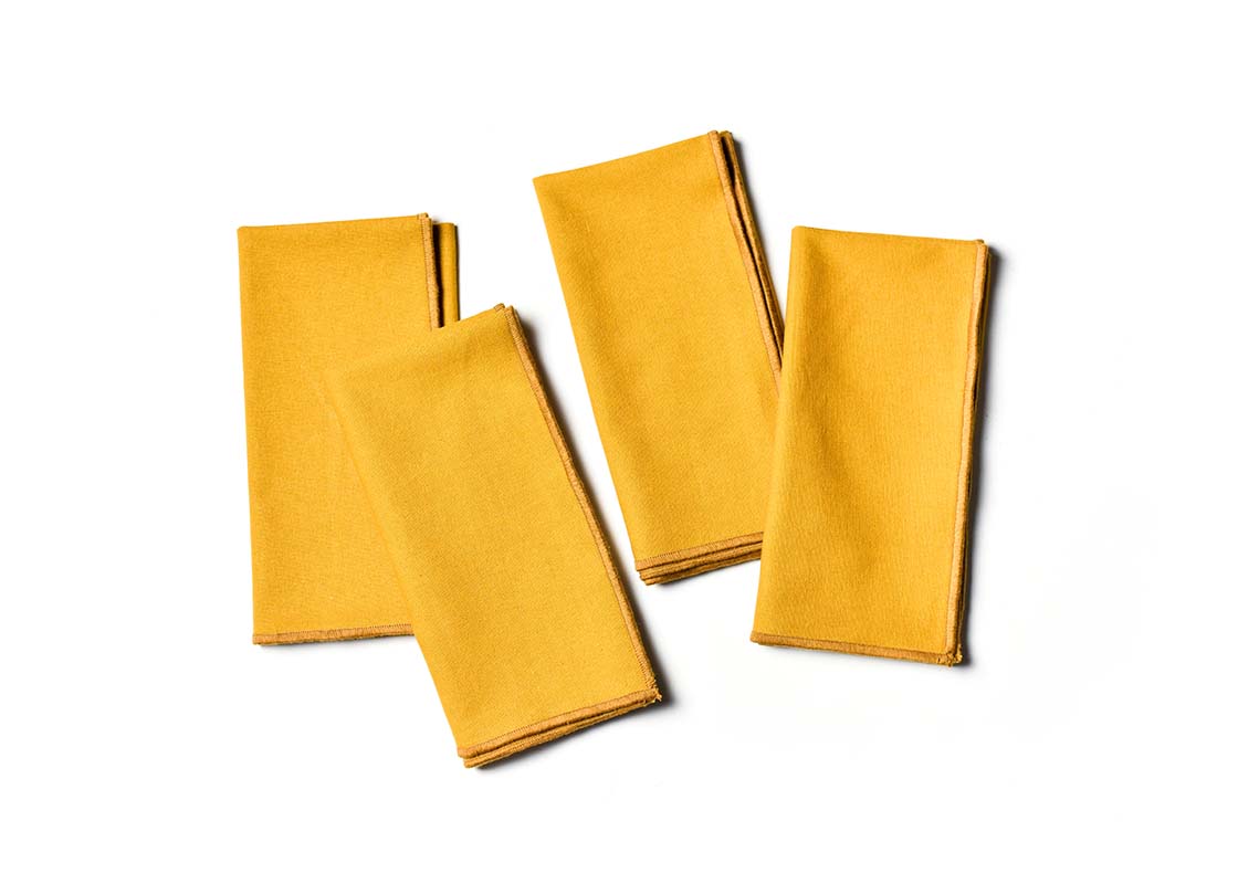 Overhead View of Folded Brass Color Block Napkins Set of 4 Showing all Pieces in Set