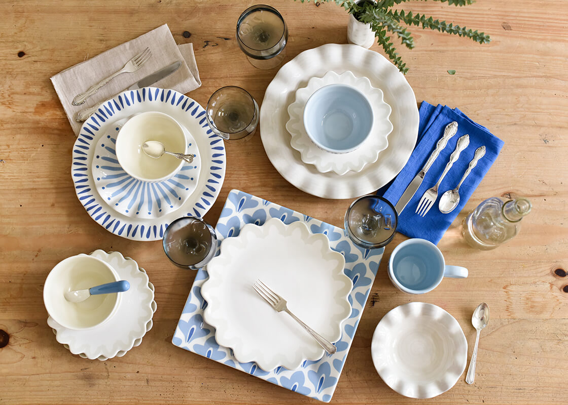 Overhead View of Coton Colors Ruffle Design Including Iris Blue Burst Ruffle Salad Plate