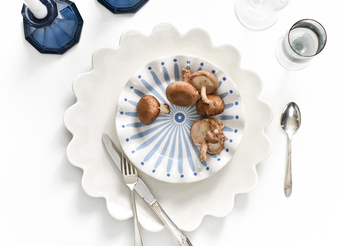 Overhead View of Individual Place Setting with Mushrooms on Ruffle Salad Plate Iris Blue Burst Design