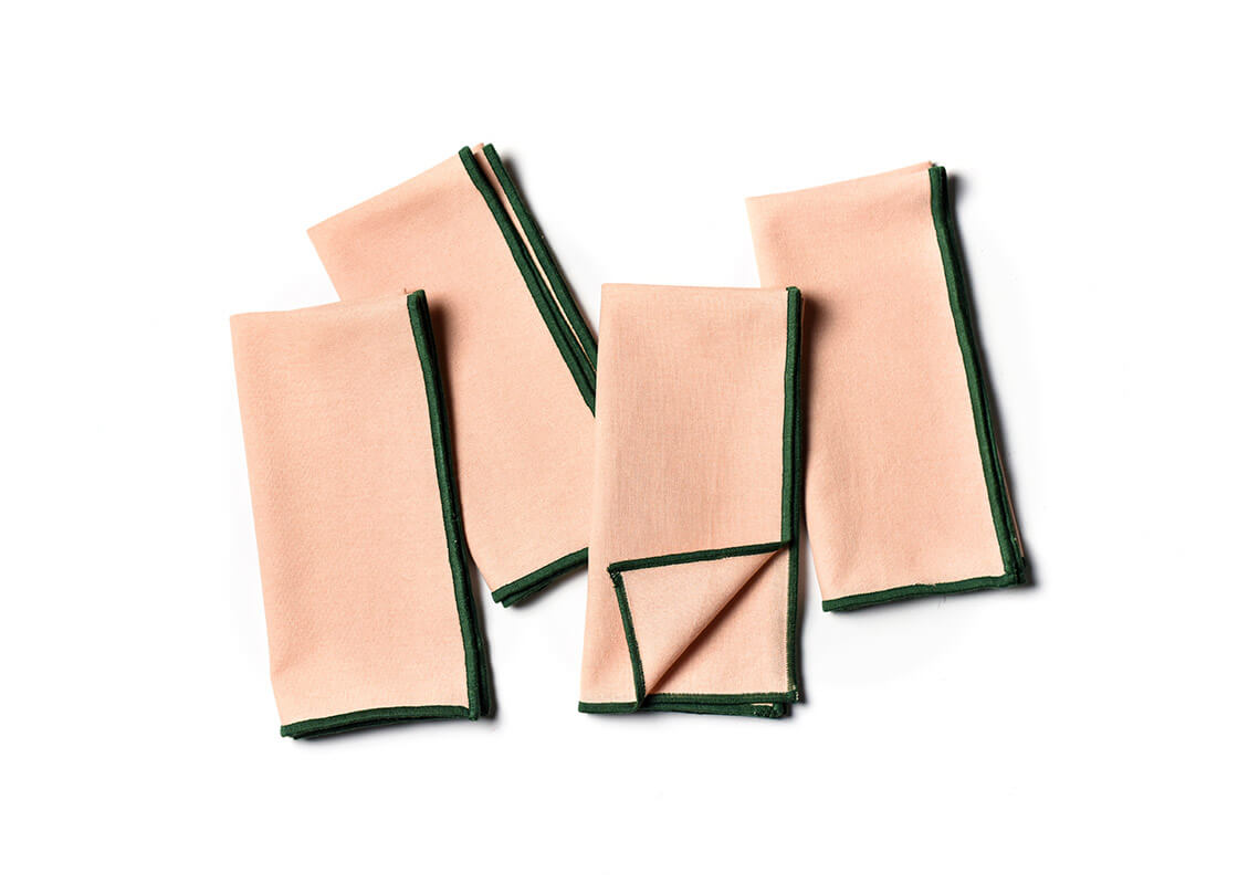 Overhead View of Folded and Creatively Styled Blush and Pine Color Block Napkins Set of 4 Showing Personality of Item