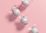 Four Inspirational Breast Cancer Survivor Ornaments on Pink Background