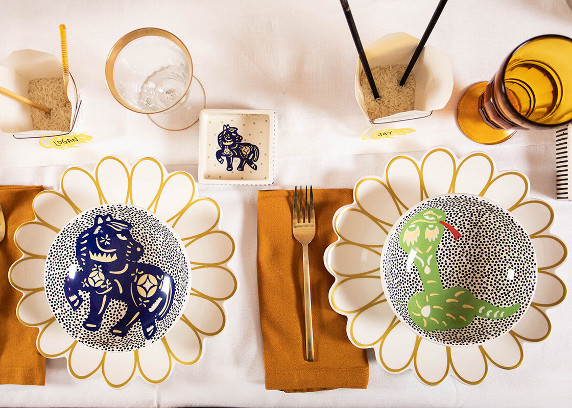 Overhead View of Two Individual Place Settings in Chinese Zodiac Themed Tablescape Including Horse Bowl