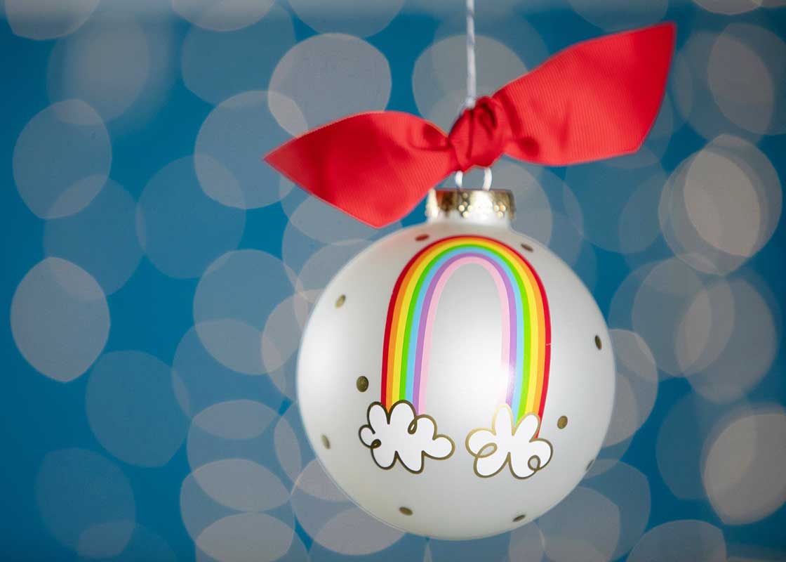 Front View of Close Up of Hand-painted Rainbow of Hope Glass Ornament with Blue Dot Background