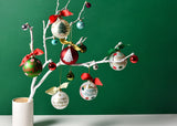 Seasonal Glass Ornaments on White Branches Including Layered Dot Happy Holidays Ornament