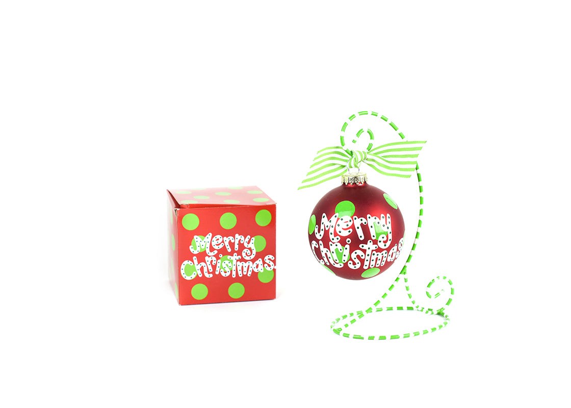 Front View of Merry Christmas Y'all Glass Ornament Placed on Green and White Stripe Display Stand and Matching Box