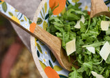 Close Up of Citrus Design Salad Server in Citrus Mango Wood Footed Bowl
