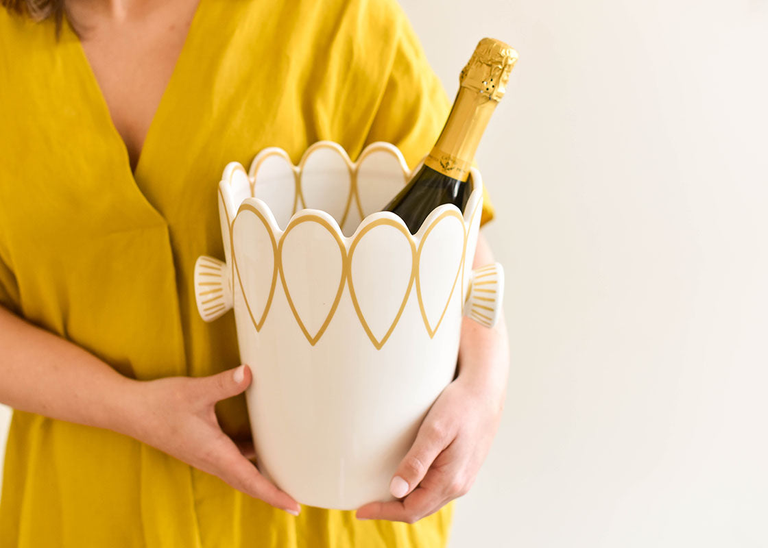 Front View of Woman Holding Deco Gold Scallop Ice Bucket with Champagne Bottle Inside