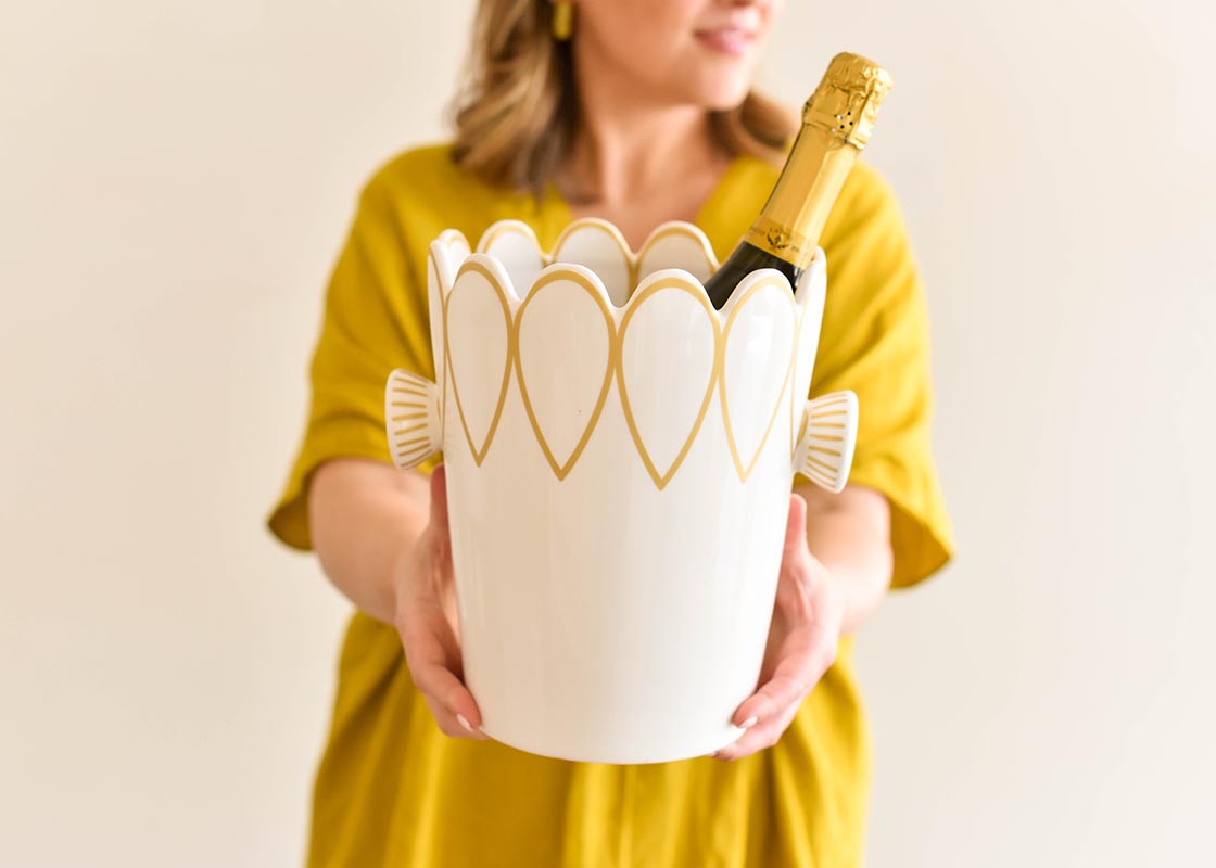 Front View of Woman Holding Deco Gold Scallop Ice Bucket Outward