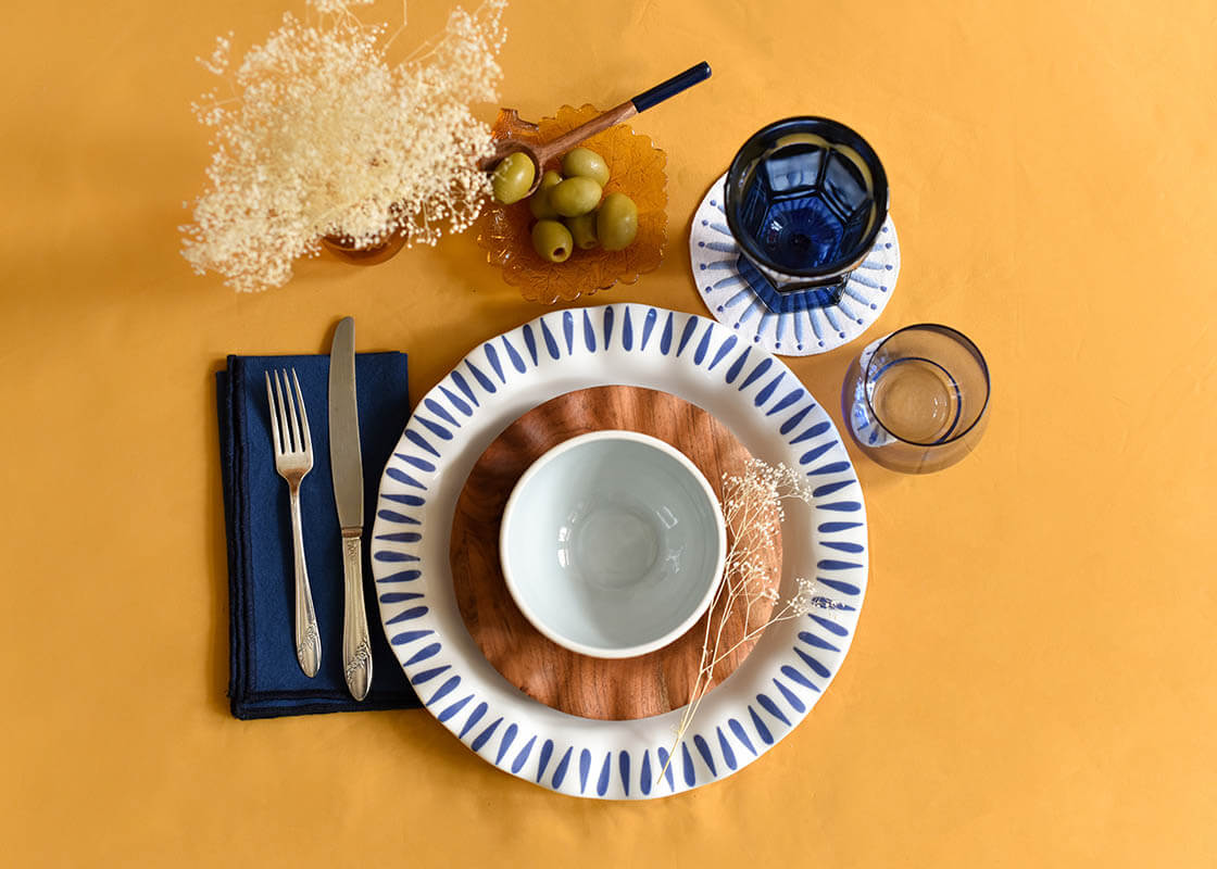 Overhead View of Individual Place Setting Mixing Fundamental Wood Salad Plate with Iris Blue Drop Ruffle Dinner Plate