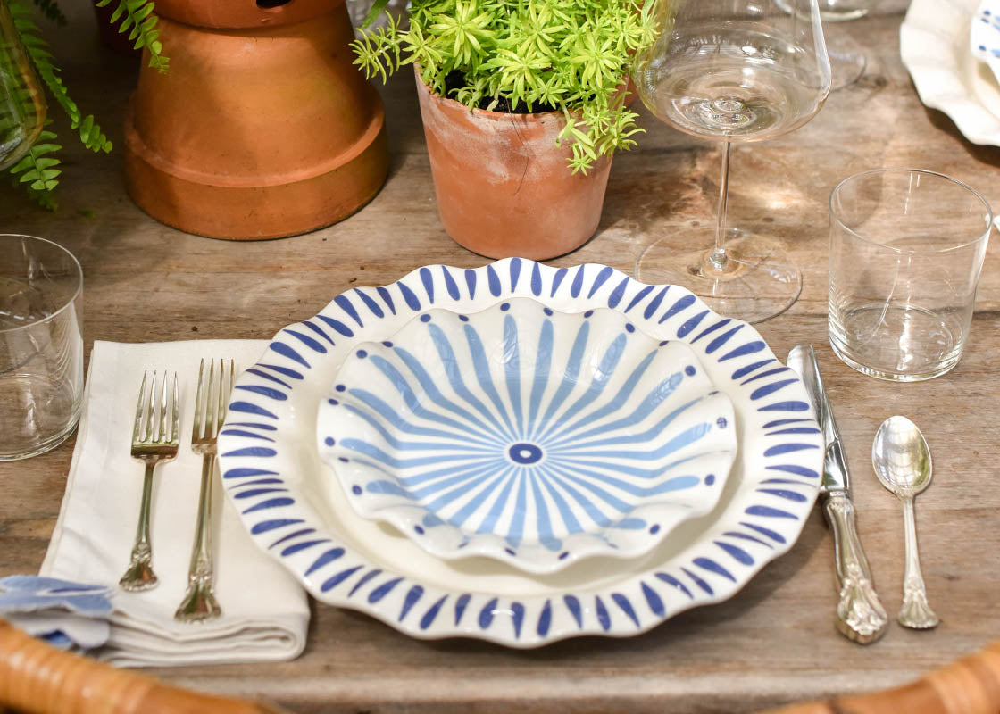 Front View of Casual Tablescape with Iris Blue Designs Including Ruffle Dinner plate