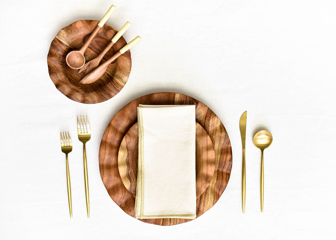 Overhead View of Fundamentals Coordinated Place Setting with Color Block Napkin in Ecru Placed on Top