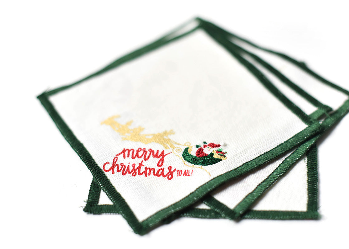 Close up of Embroidery on Loosely Stacked Flying Santa Cocktail Napkins Set of 4 Showing Pretty Fabric Texture