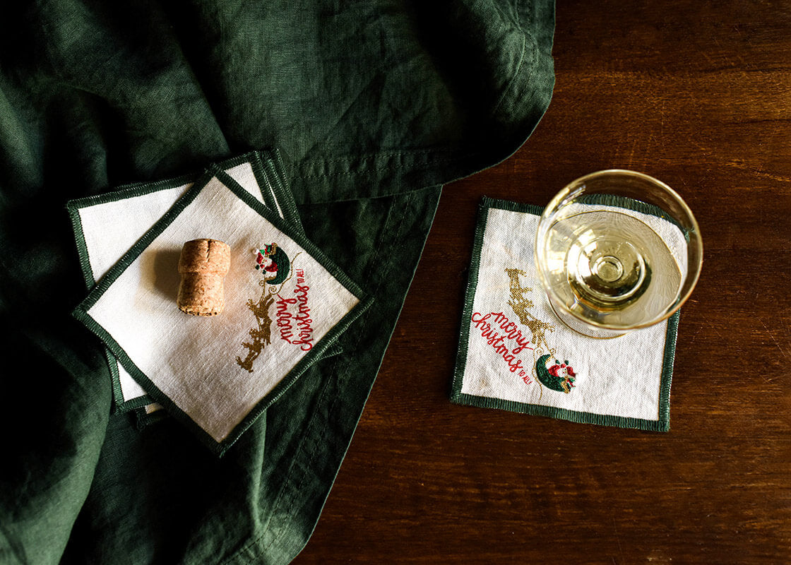 Overhead View of Single Glass of Wine Served with Flying Santa Linen Cocktail Napkin