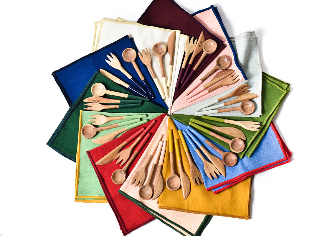 Overhead View of Color Coordinated Color Block Napkins and Wood Utensils Including Provence Wood Appetizer Spreader