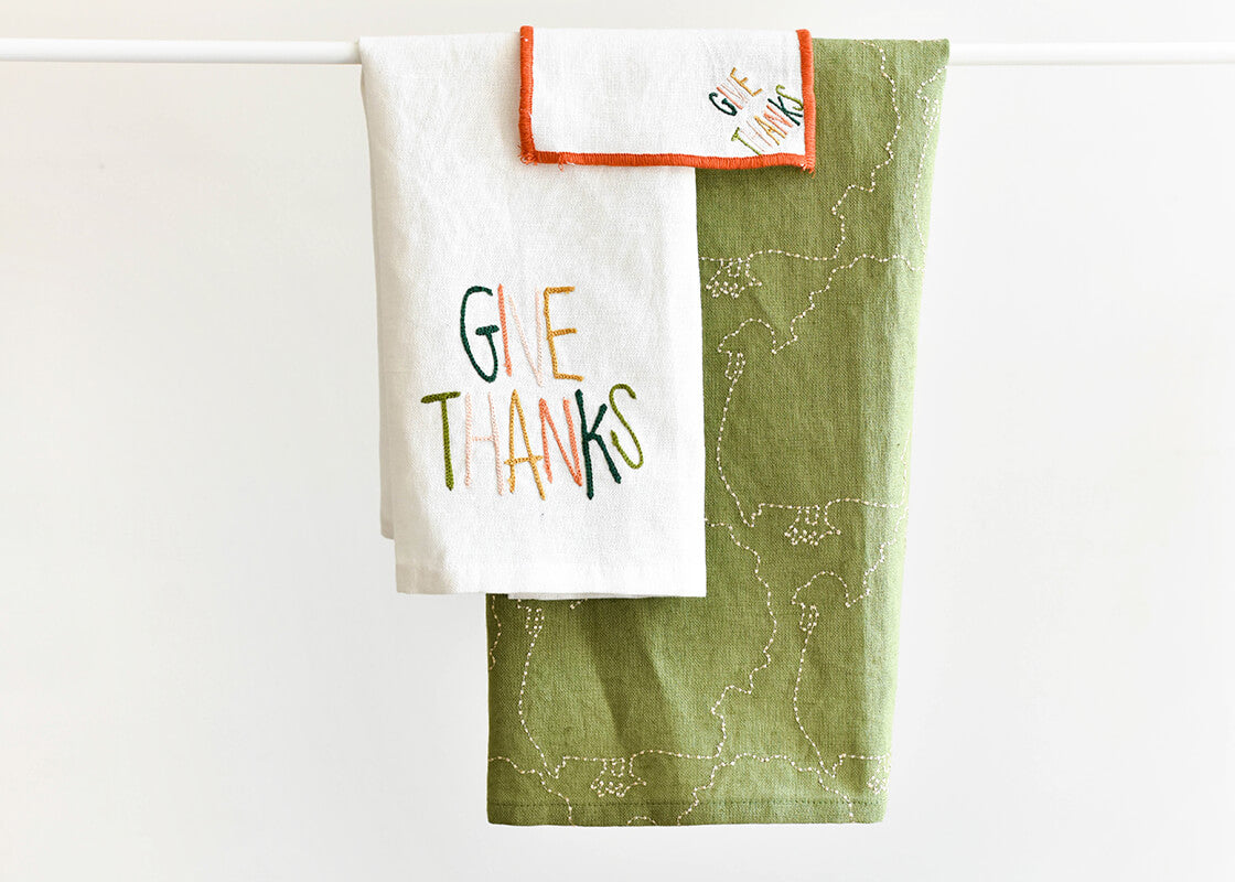 Front View of Give Thanks Small Hand Towel with Coordinating Thanksgiving Linens Layered for Inspiration