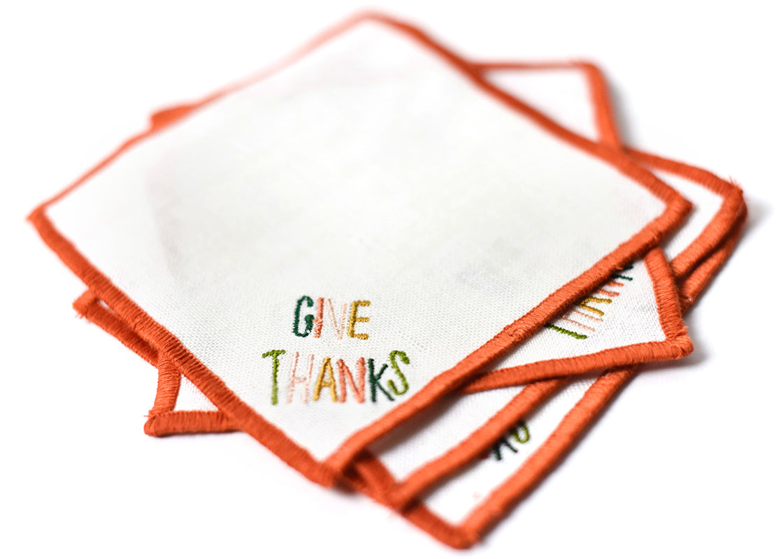 Close up of Embroidery on Loosely Stacked Dusk Give Thanks Cocktail Napkins Set of 4 Showing Pretty Fabric Texture