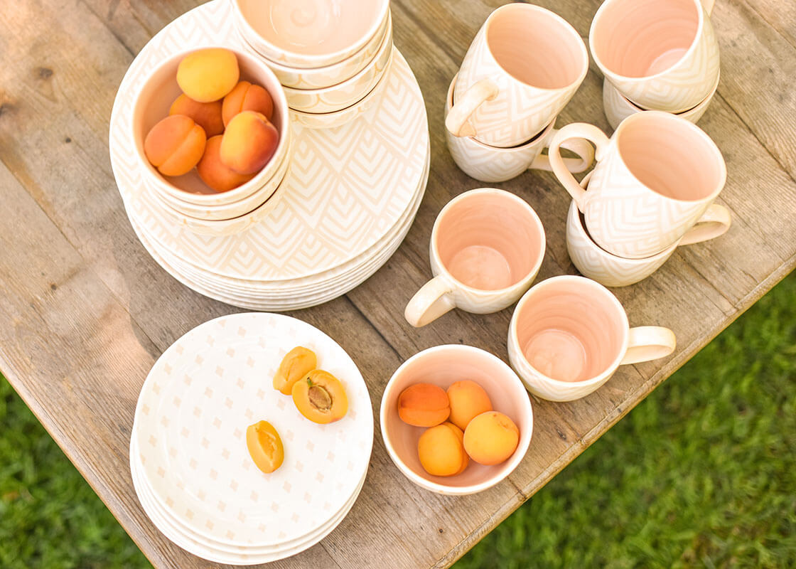 Overhead View of Blush Dinnerware Collection Including Blush Layered Diamond Mug