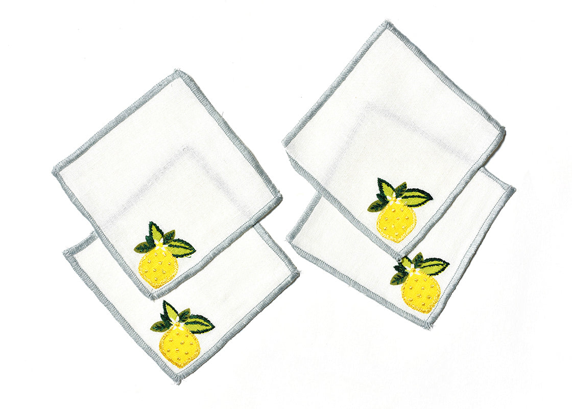 Overhead View of Creatively Placed Lemon Cocktail Napkins Set of 4 Showing all Pieces in Set and Personality