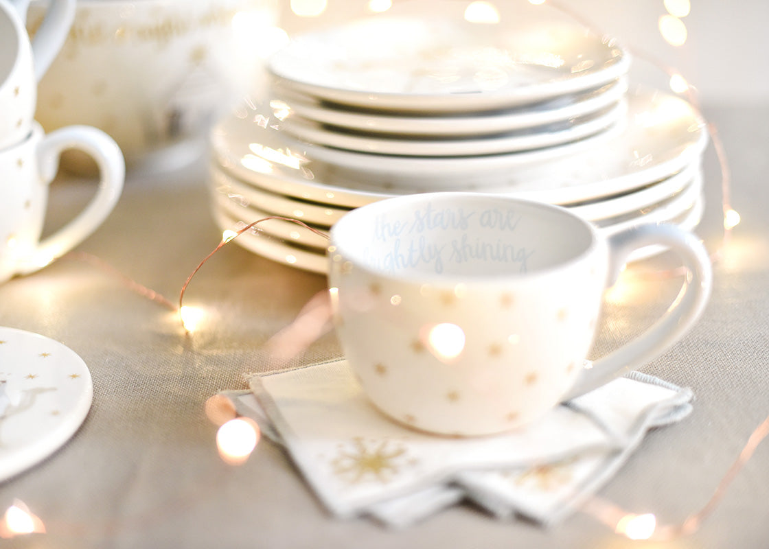 Front View of Sparkle Lights Accentuate the Gold Stars on O Holy Night Mug on Tablescape