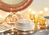 Tablescape of O Holy Night Salad Plates in Twinkly Light
