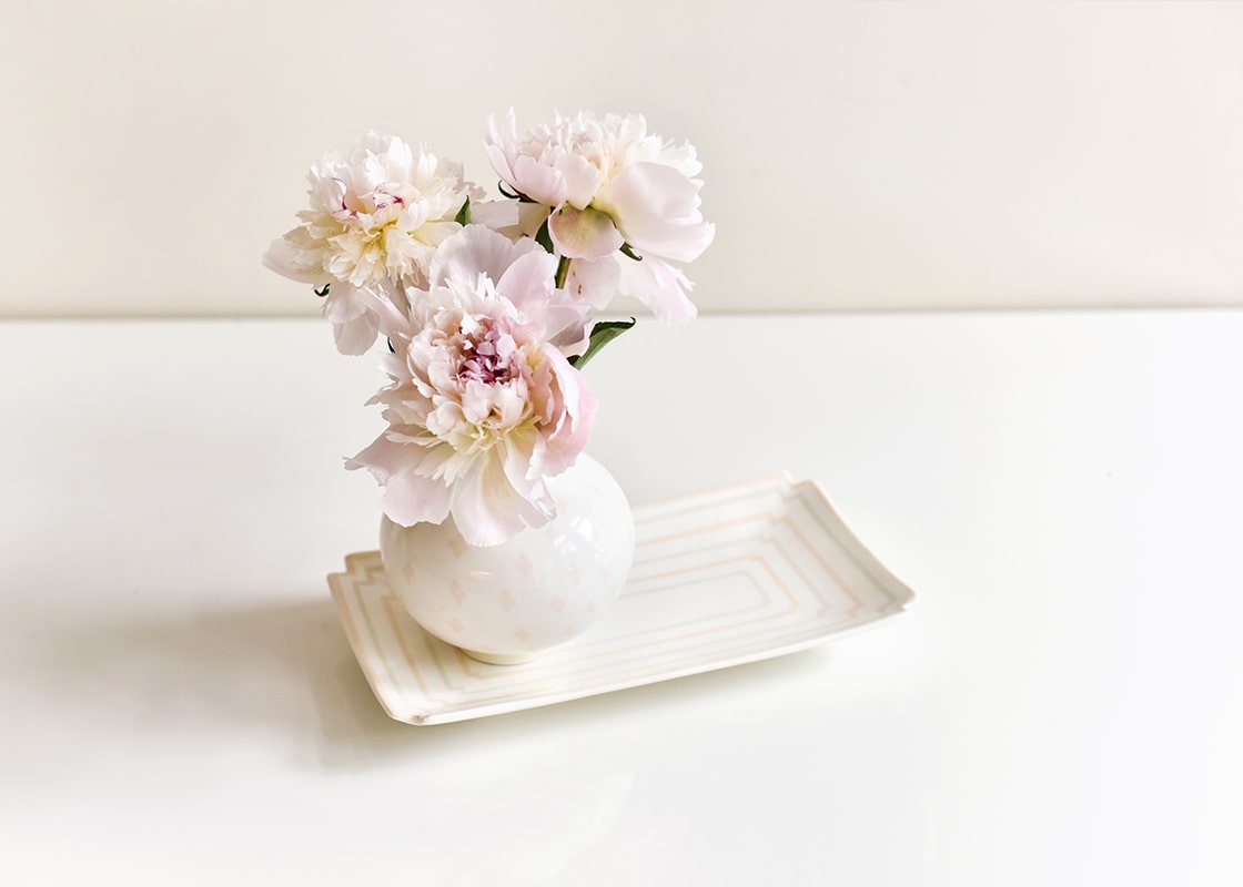 Front View of Peonies in a Vase on a Blush Notch Tray