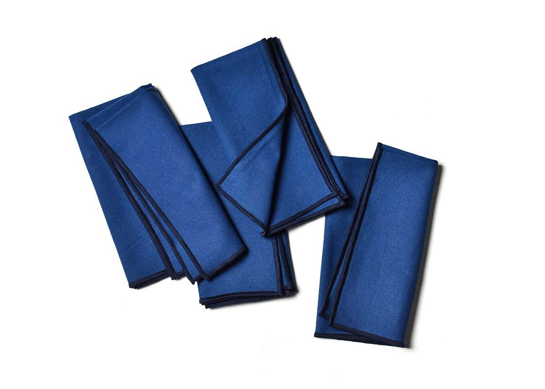 Overhead View of Folded and Creatively Styled Navy Color Block Napkins Set of 4 Showing Personality of Item