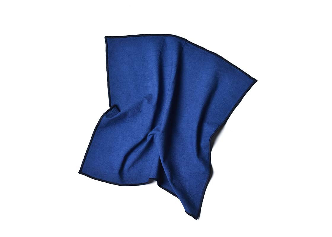 Overhead View of Crumpled Napkin Navy Color Block Napkin Showcasing Texture and Personality