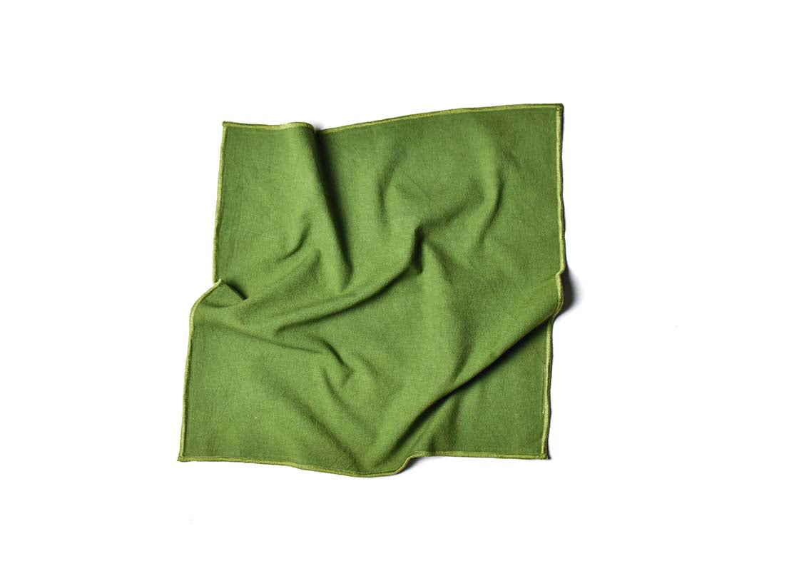 Overhead View of Crumpled Napkin Olive Color Block Napkin Showcasing Texture and Personality