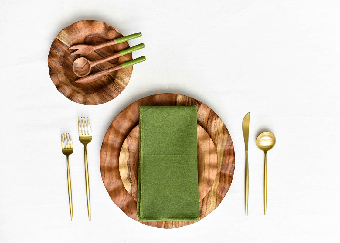 Overhead View of Fundamentals Wood Place Setting Coordinated with Olive Color Block Linen Napkin  Placed on Top