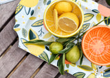 Orange Appetizer Bowl Beside Lemon Bowl Filled with Lemon Slices