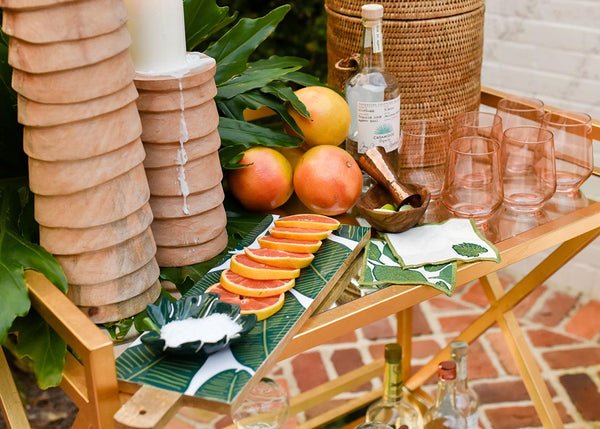 Tablescape with Coordinating Palm Designs Including Large Rectangle Board