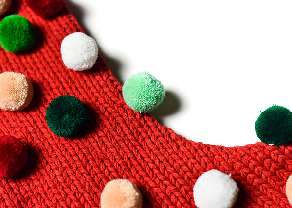 Close Up of Red Knit Stocking Christmas in the Village Pom Pom Design