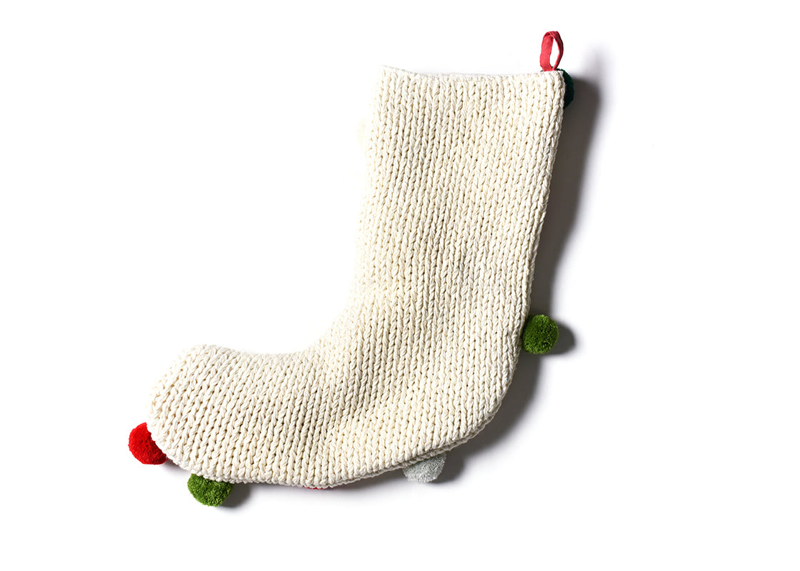 Overhead View of Seasonal Decor Including Christmas Knit Stocking with Pom Poms
