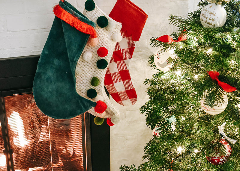 Christmas Stockings Hung on the Mantle Including Christmas Knit Stocking with Pom Poms
