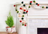 Christmas Knit Stocking with Pom Poms and Coordinating Pom Pom Garland on Mantle