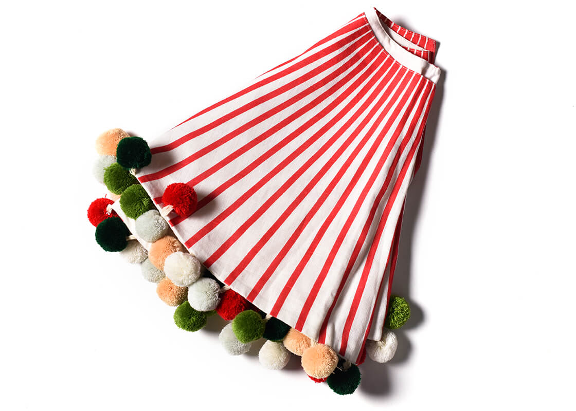 Overhead View of Folded Red Stripe Tree Skirt with Pom Poms Showing Closer View of Design Details