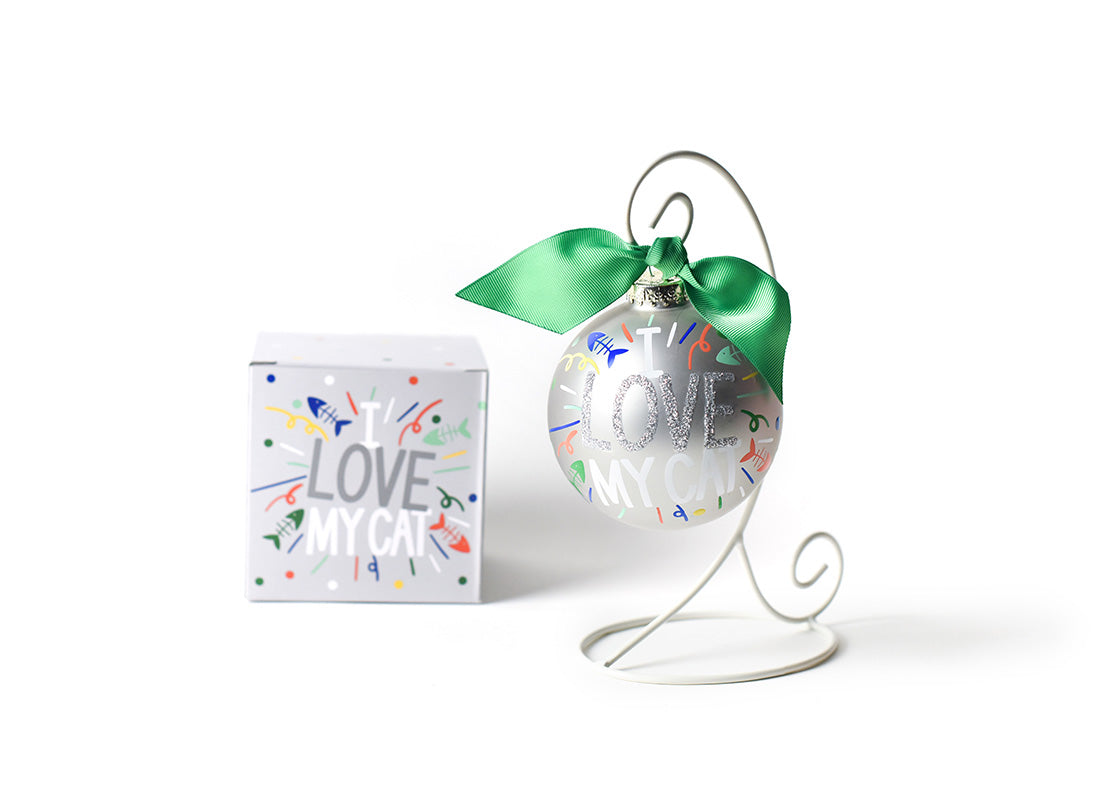 Front View of I Love My Cat Popper Glass Ornament Placed on White Display Stand with Matching Box