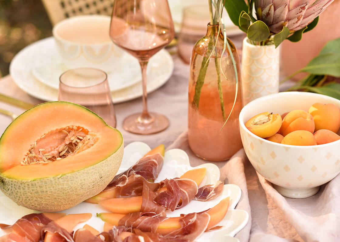 Cropped View of Breakfast Tablescape Including Footed Bowl Ecru Quatrefoil Design